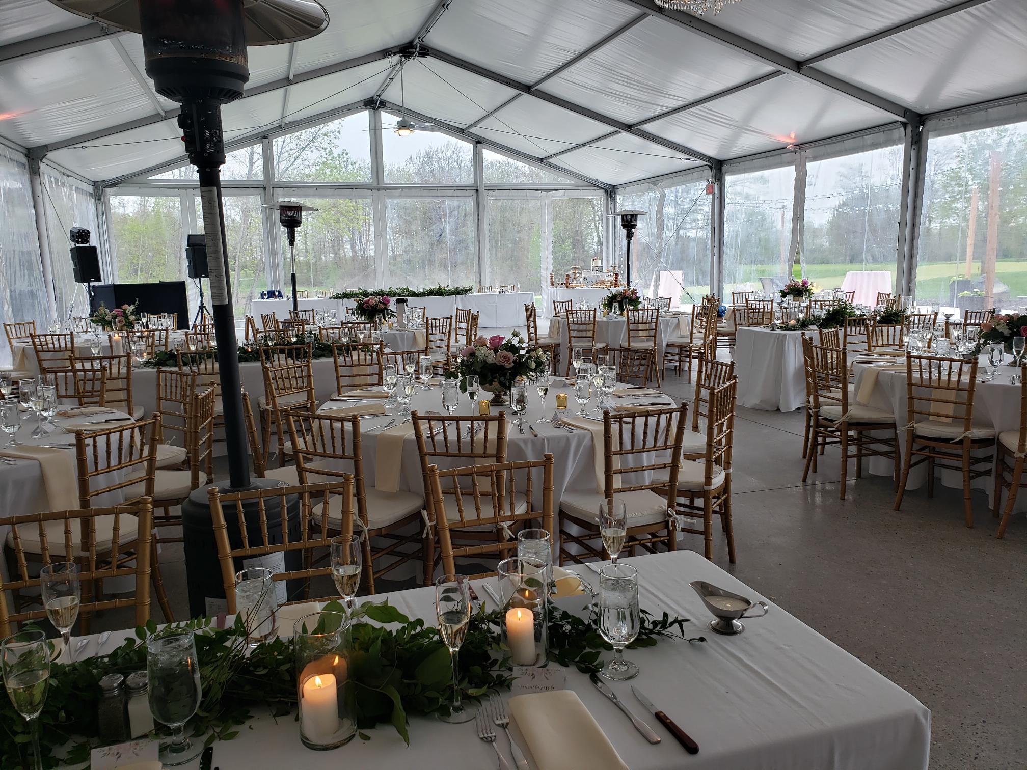 Elegant tent setup with gold chairs for a private event at Quail Ridge