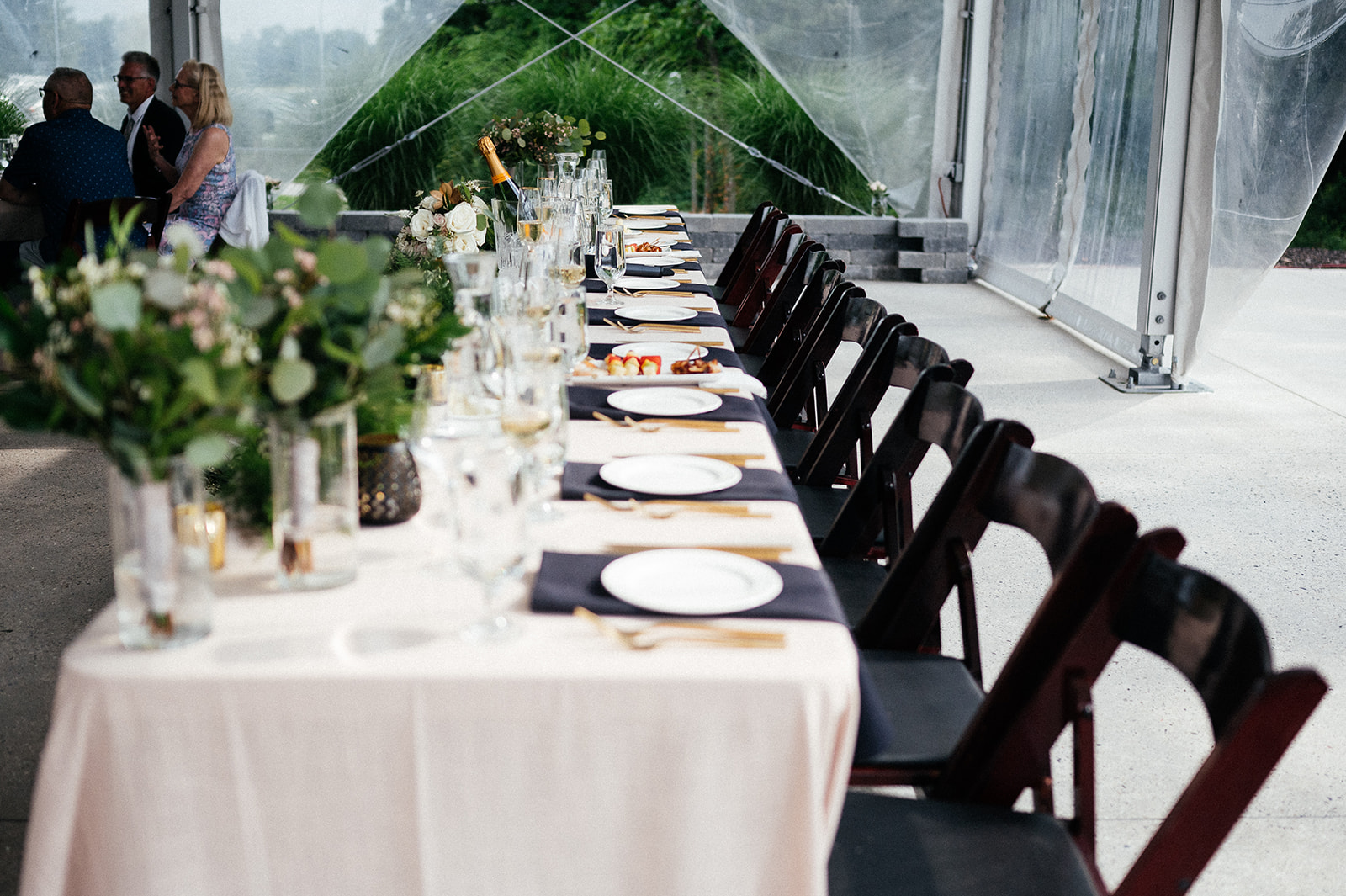 Wedding head table decorated inside the Quail Ridge reception space